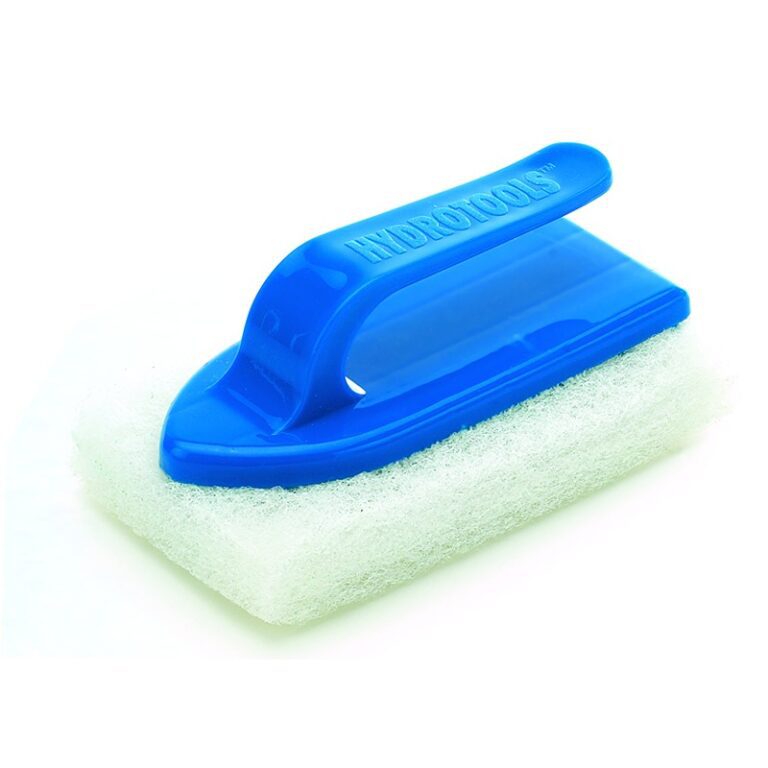 A blue and white sponge with handle on top of it.